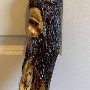 brown haired wood spirit walking stick